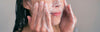 Woman cleansing her skin